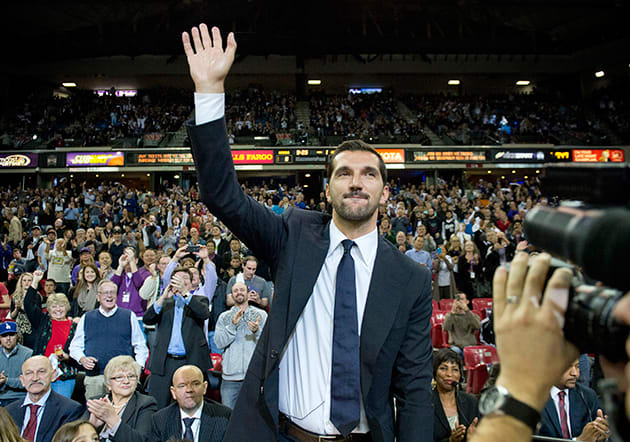 Peja Stojakovic, a central figure of the great Kings teams of the late-90s and early-2000s, waves to fans as his number is retired.
